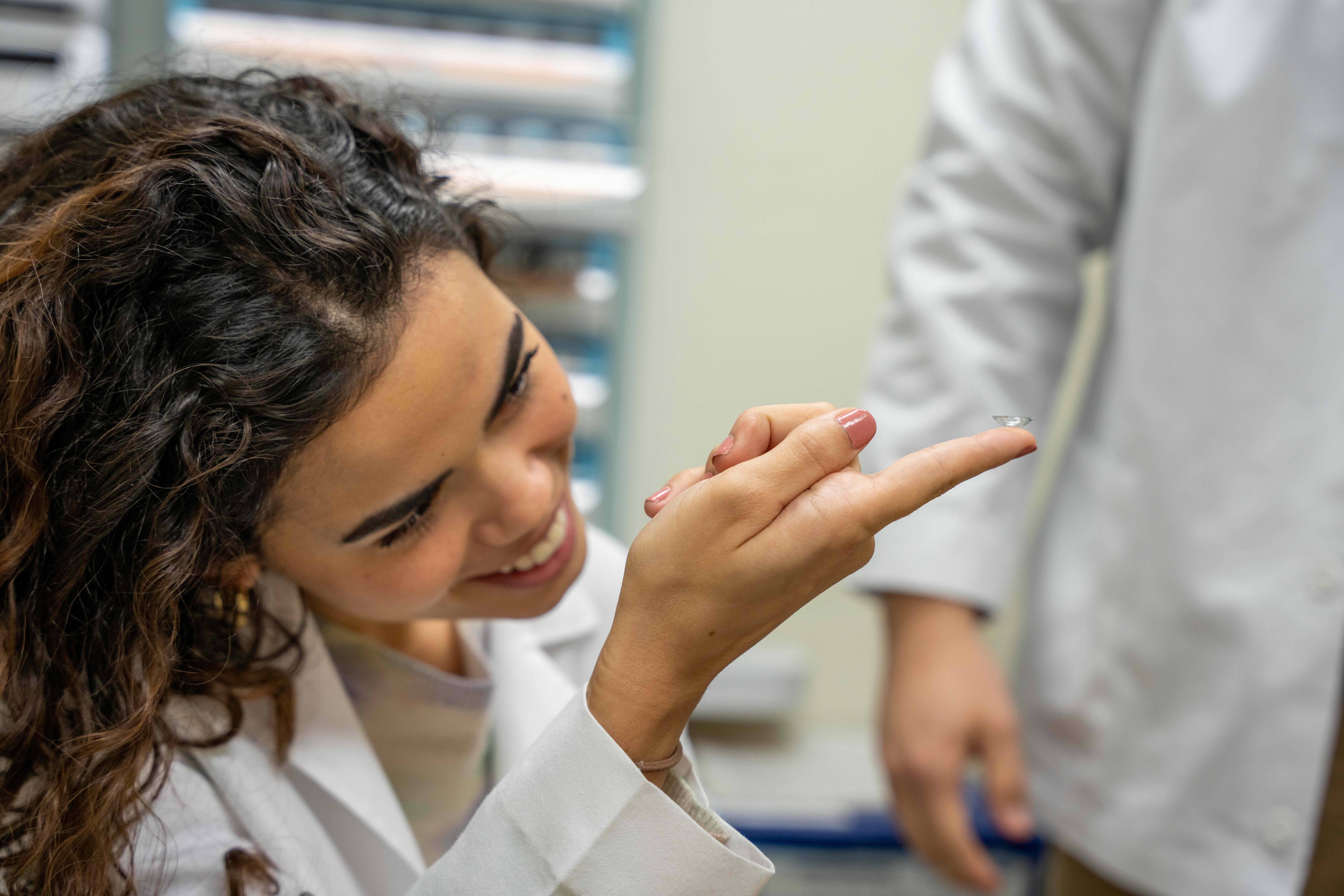 RSO student examining patient's eyes