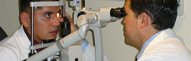 Doctor giving patient an eye exam
